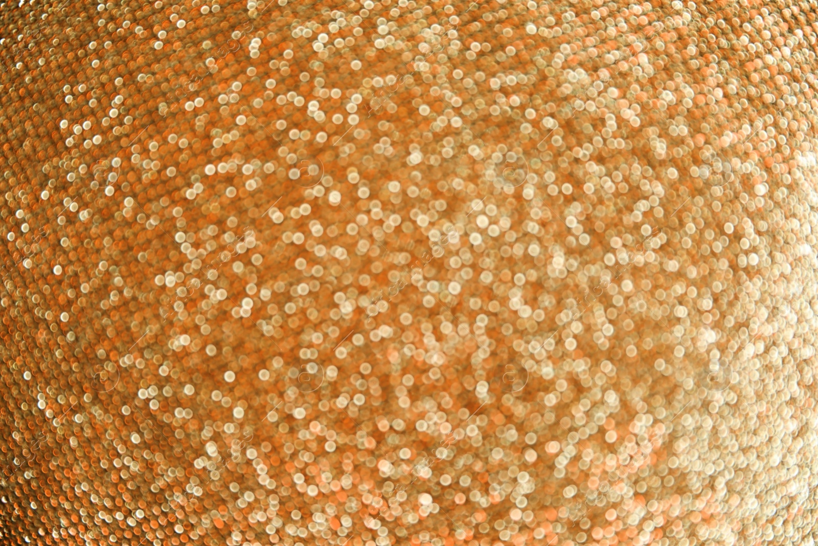 Photo of Gold glitter with bokeh effect as background, closeup