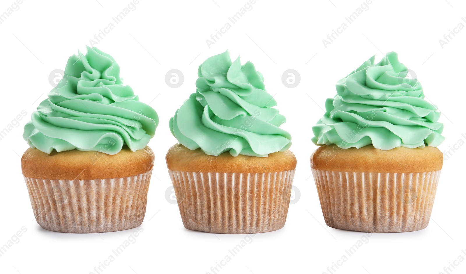 Photo of Delicious cupcakes with cream on white background