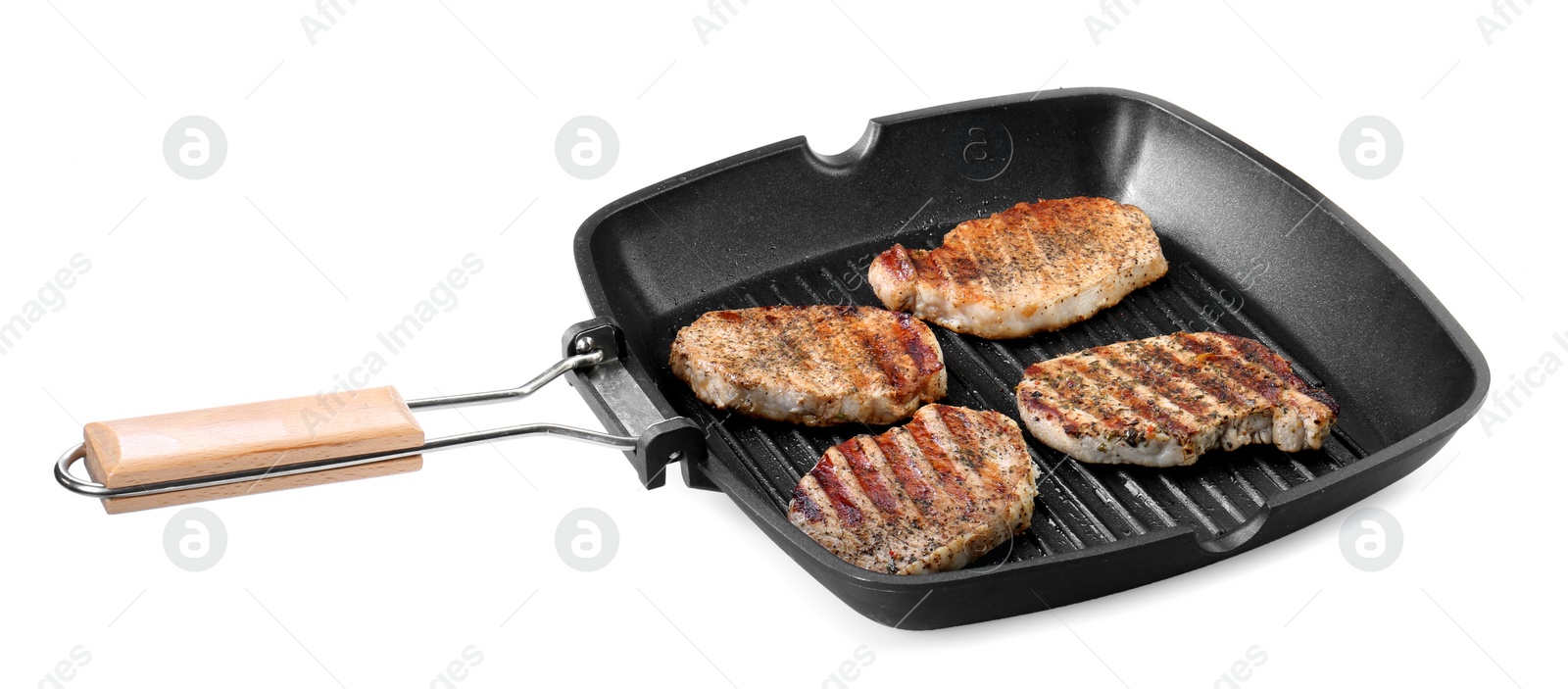 Photo of Grill pan with delicious pork steaks isolated on white