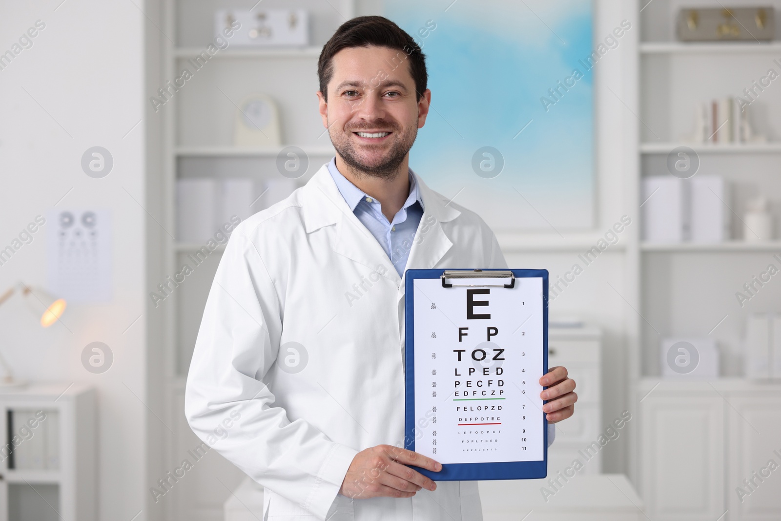 Photo of Ophthalmologist with vision test chart in clinic