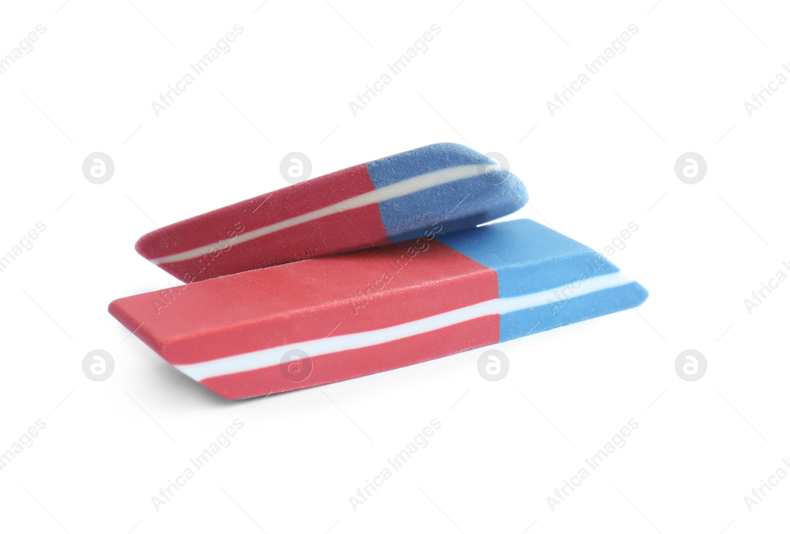 Photo of New double erasers isolated on white. School stationery