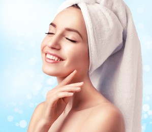 Image of Beautiful young woman with silky skin on light background. Spa treatment 