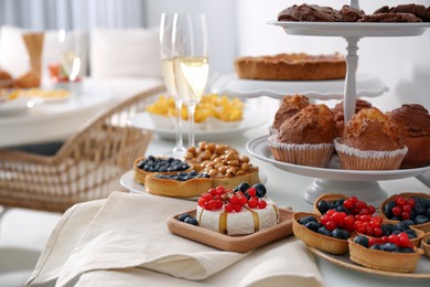 Variety of snacks served on tables indoors in buffet style