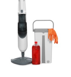 Modern steam mop, bucket with gloves and bottle of cleaning product isolated on white