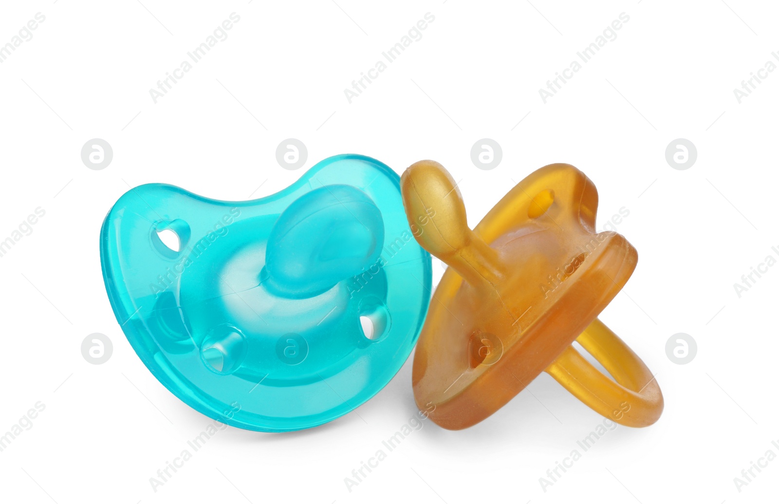 Photo of New different baby pacifiers on white background