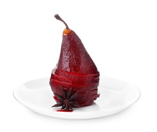 Photo of Tasty red wine poached pear isolated on white