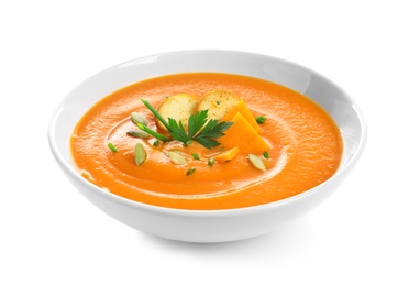 Photo of Dish with pumpkin cream soup on white background. Healthy food