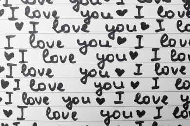 Notebook page with words I LOVE YOU and hearts as background, top view