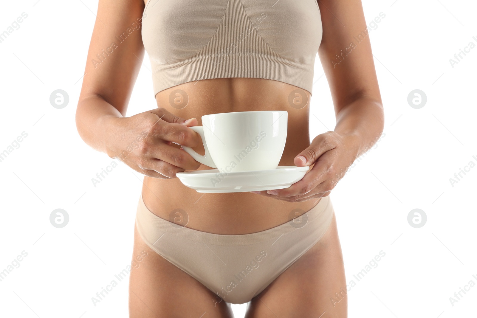 Photo of Young woman holding cup of diet tea on white background, closeup