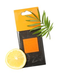Photo of Scented sachet, lemon and green leaf on white background, top view