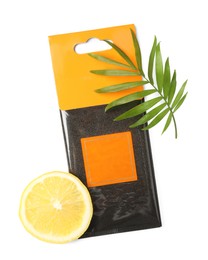 Scented sachet, lemon and green leaf on white background, top view