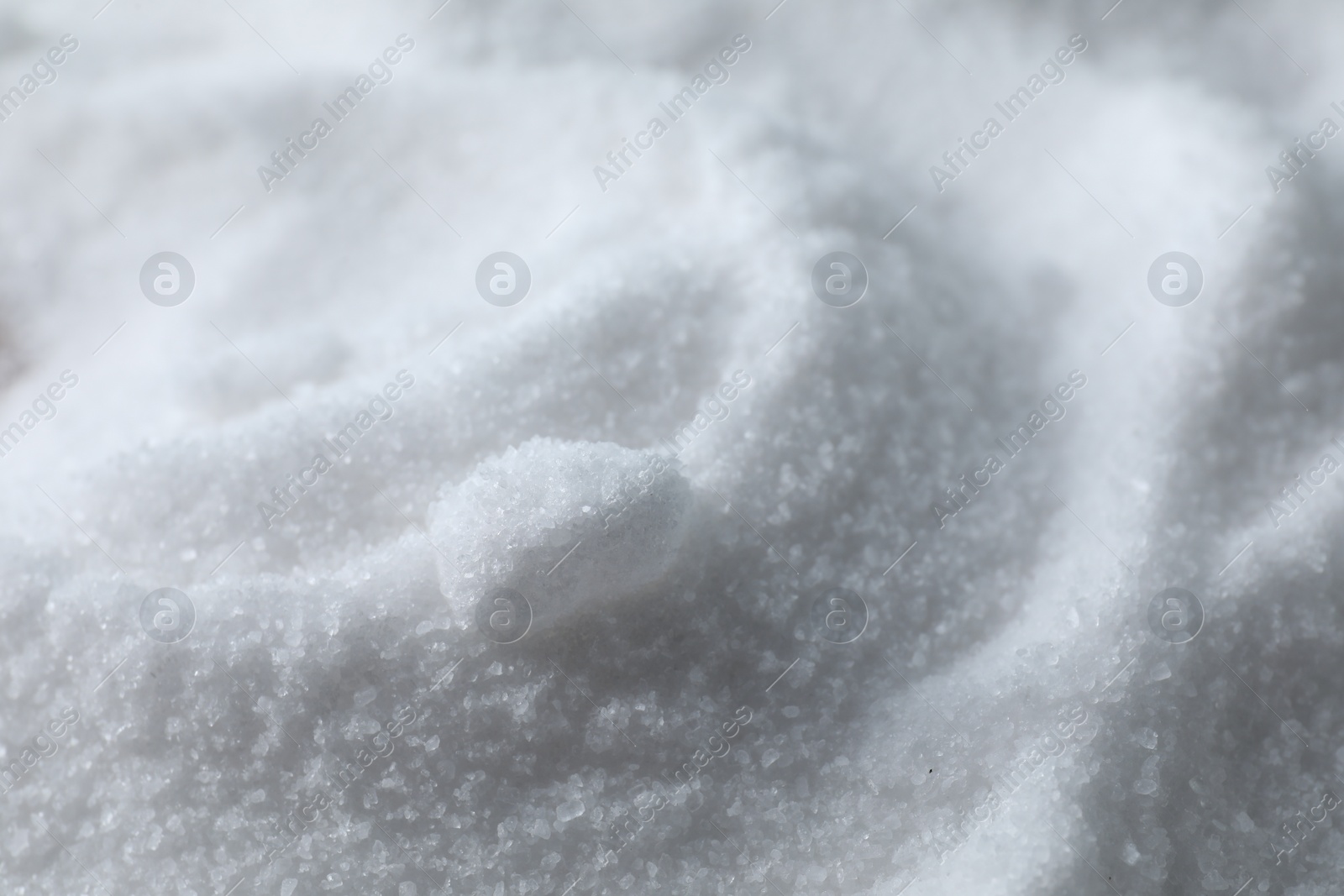 Photo of Organic white sea salt as background, closeup