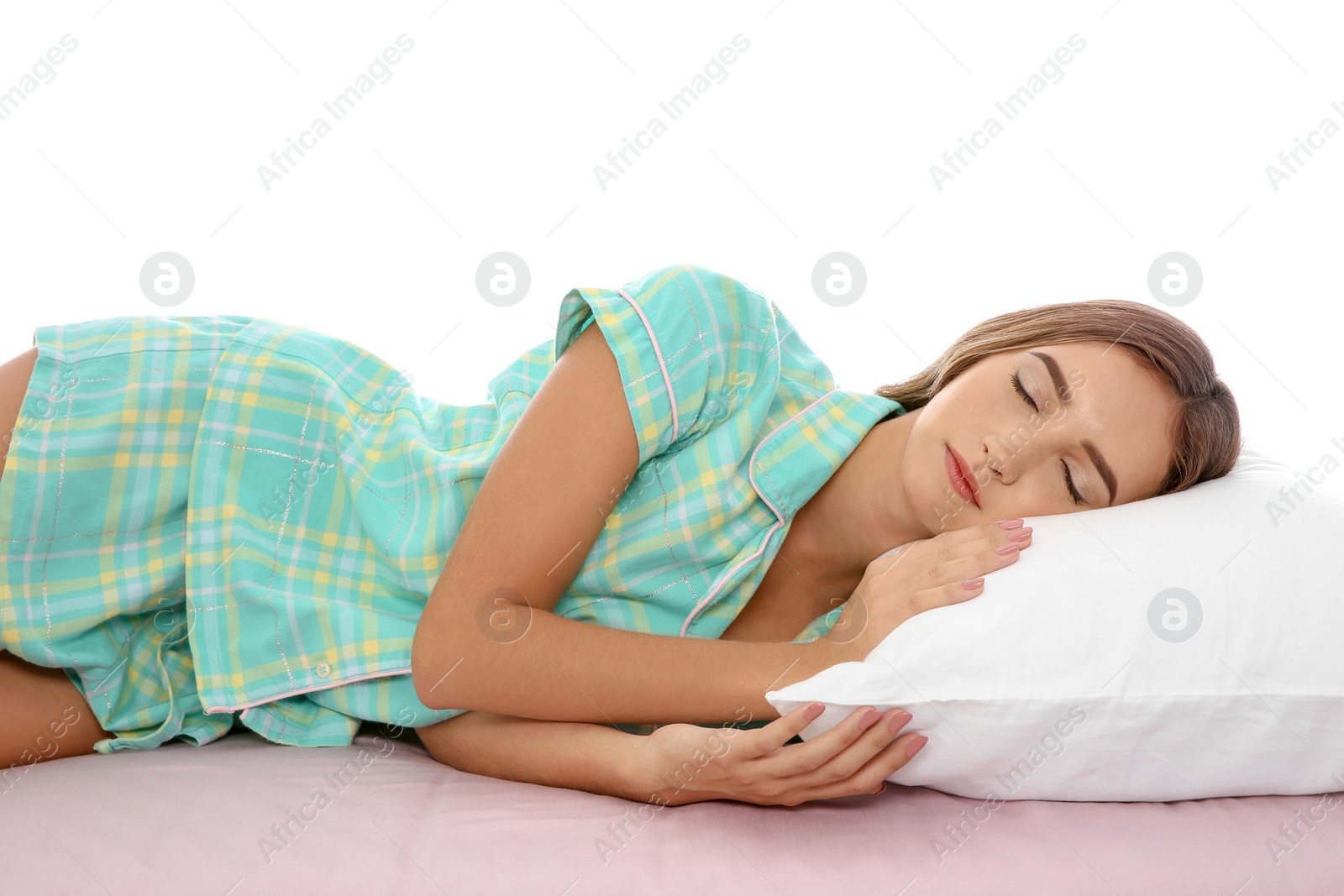 Photo of Beautiful teen girl sleeping with comfortable pillow on bed against white background