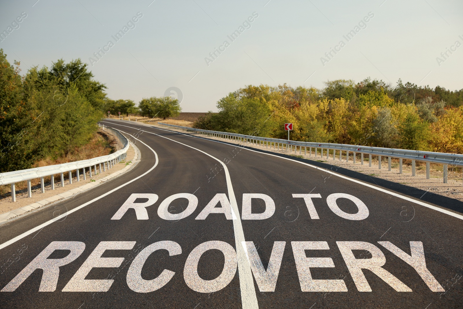 Image of Start to live without alcohol addiction. Phrase ROAD TO RECOVERY on asphalt highway