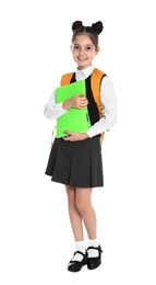 Happy girl in school uniform on white background