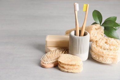 Photo of Composition with natural loofah sponges on table. Space for text