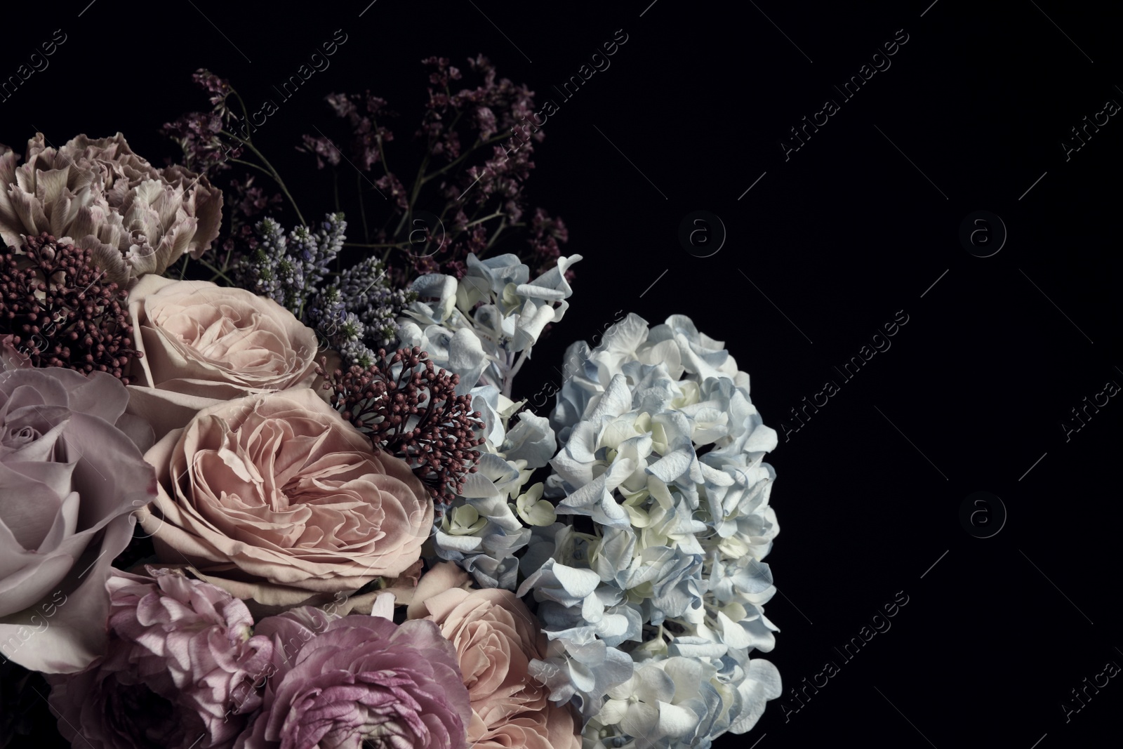 Photo of Beautiful bouquet of different flowers on black background. Floral card design with dark vintage effect