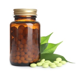 Photo of Bottle with vitamin pills and green leaves on white background