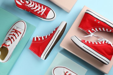 Photo of Many different sneakers on color background, flat lay
