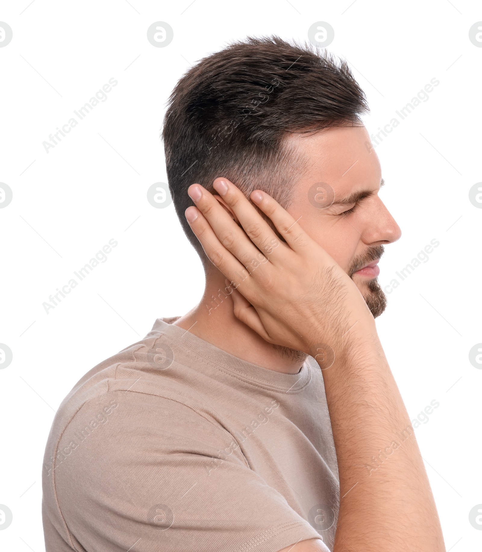 Photo of Young man suffering from ear pain on white background