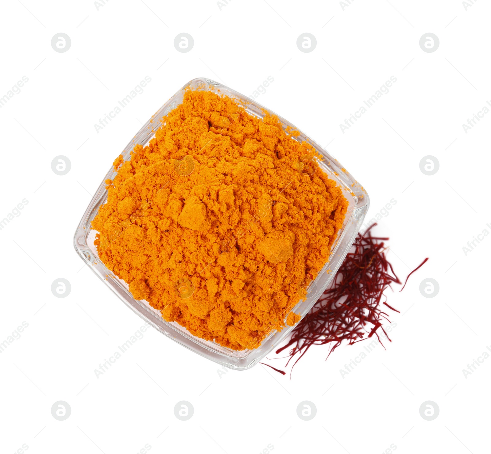 Photo of Bowl with saffron powder and dried flower stigmas on white background, top view