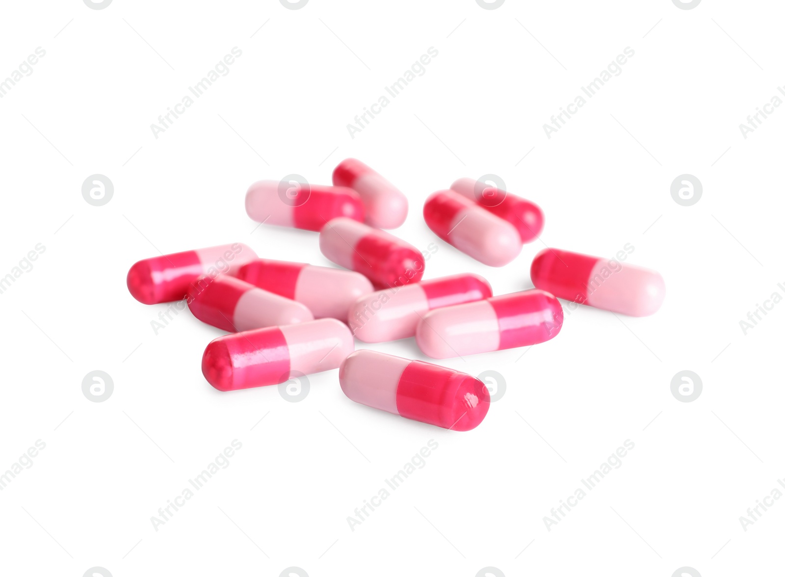 Photo of Many pink pills isolated on white. Medicinal treatment