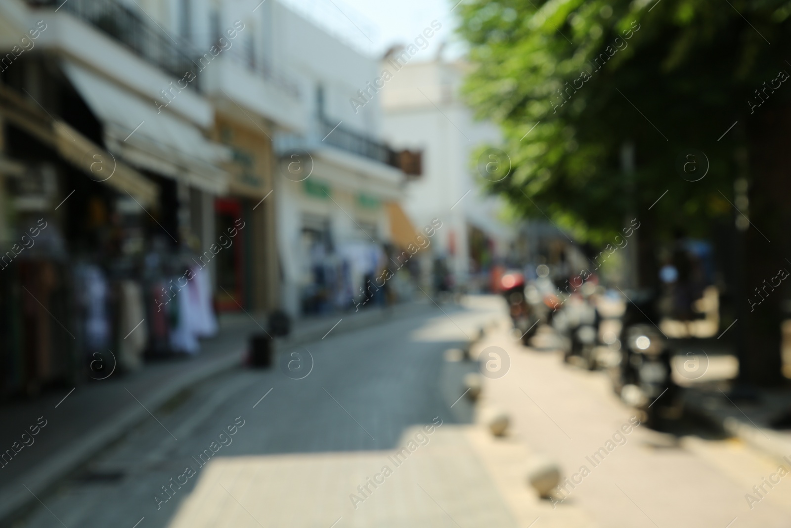 Photo of Blurred view of city street on sunny day