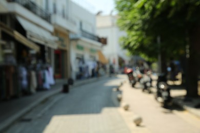 Photo of Blurred view of city street on sunny day