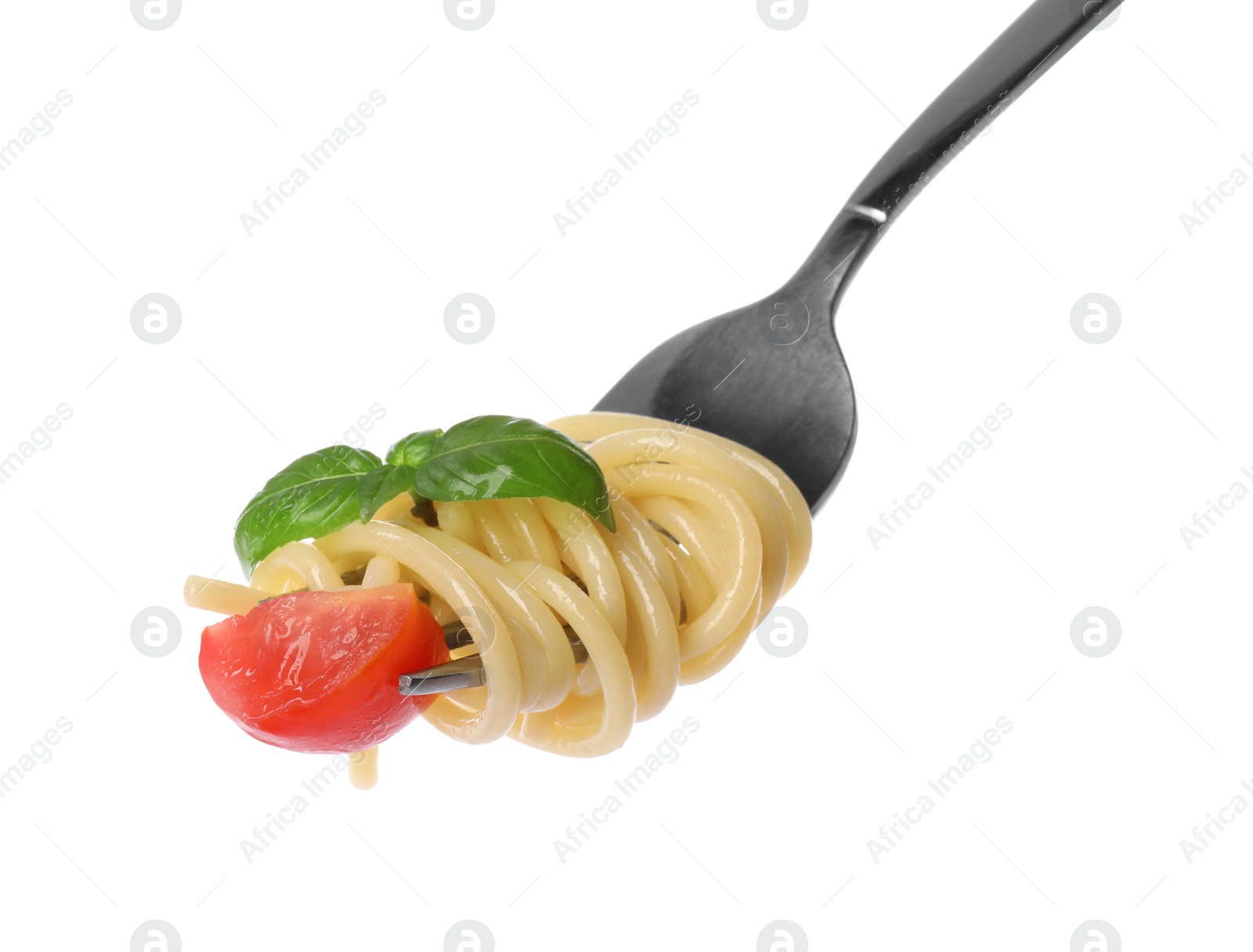 Photo of Fork with tasty pasta, piece of fresh tomato and basil isolated on white