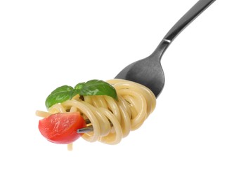 Photo of Fork with tasty pasta, piece of fresh tomato and basil isolated on white