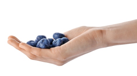 Photo of Woman holding fresh ripe blueberries on white background, closeup view