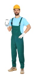 Professional repairman in uniform showing smartphone on white background