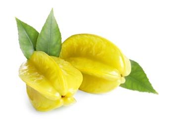 Ripe carambolas with green leaves on white background