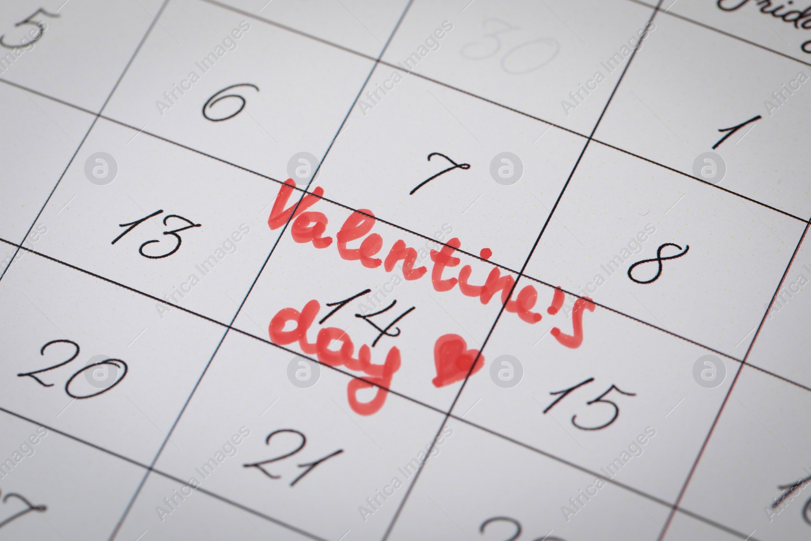Photo of Calendar page with marked Valentine's Day, closeup