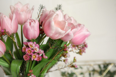 Photo of Beautiful bouquet with spring pink tulips on light background, closeup