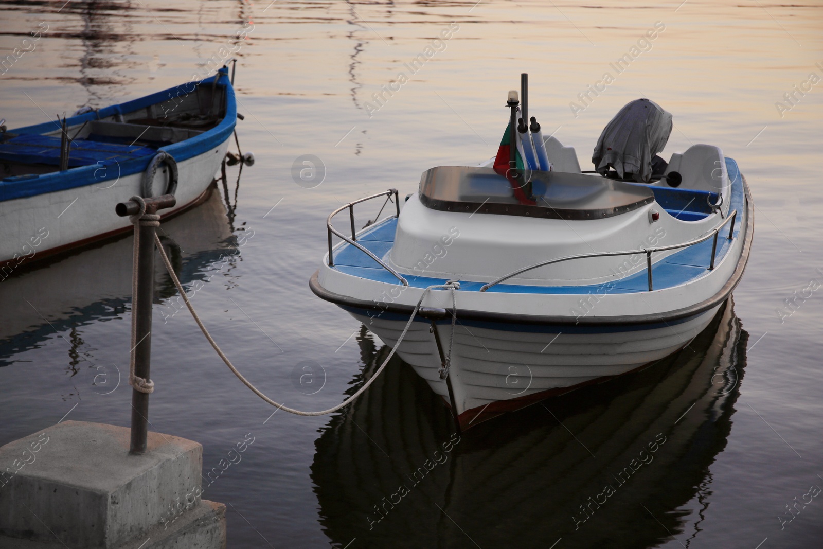 Photo of Beautiful view of river with moored boats at sunset