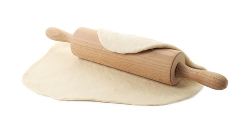 Photo of Raw dough and rolling pin isolated on white