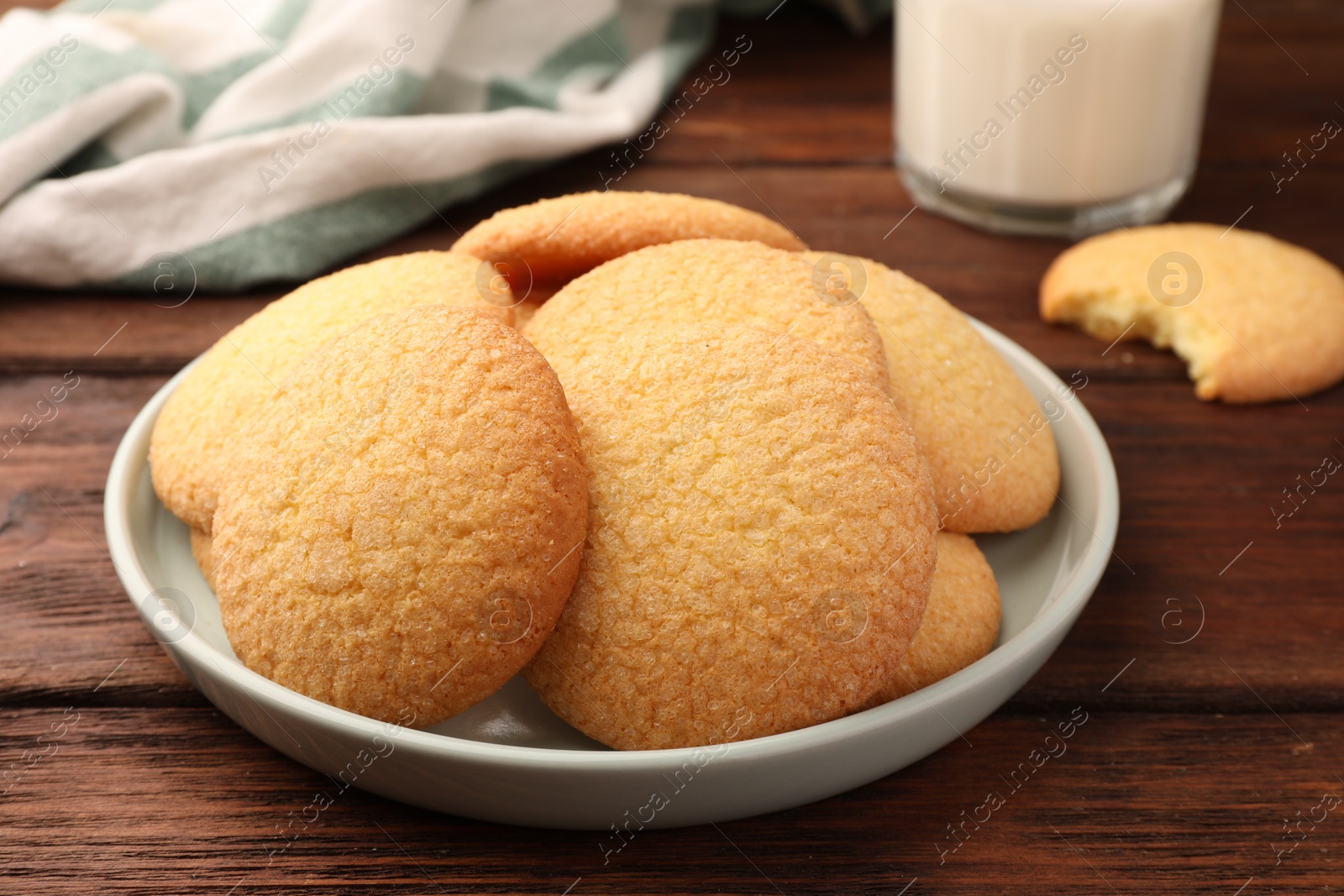 Photo of Delicious Danish butter cookies on wooden table, closeup