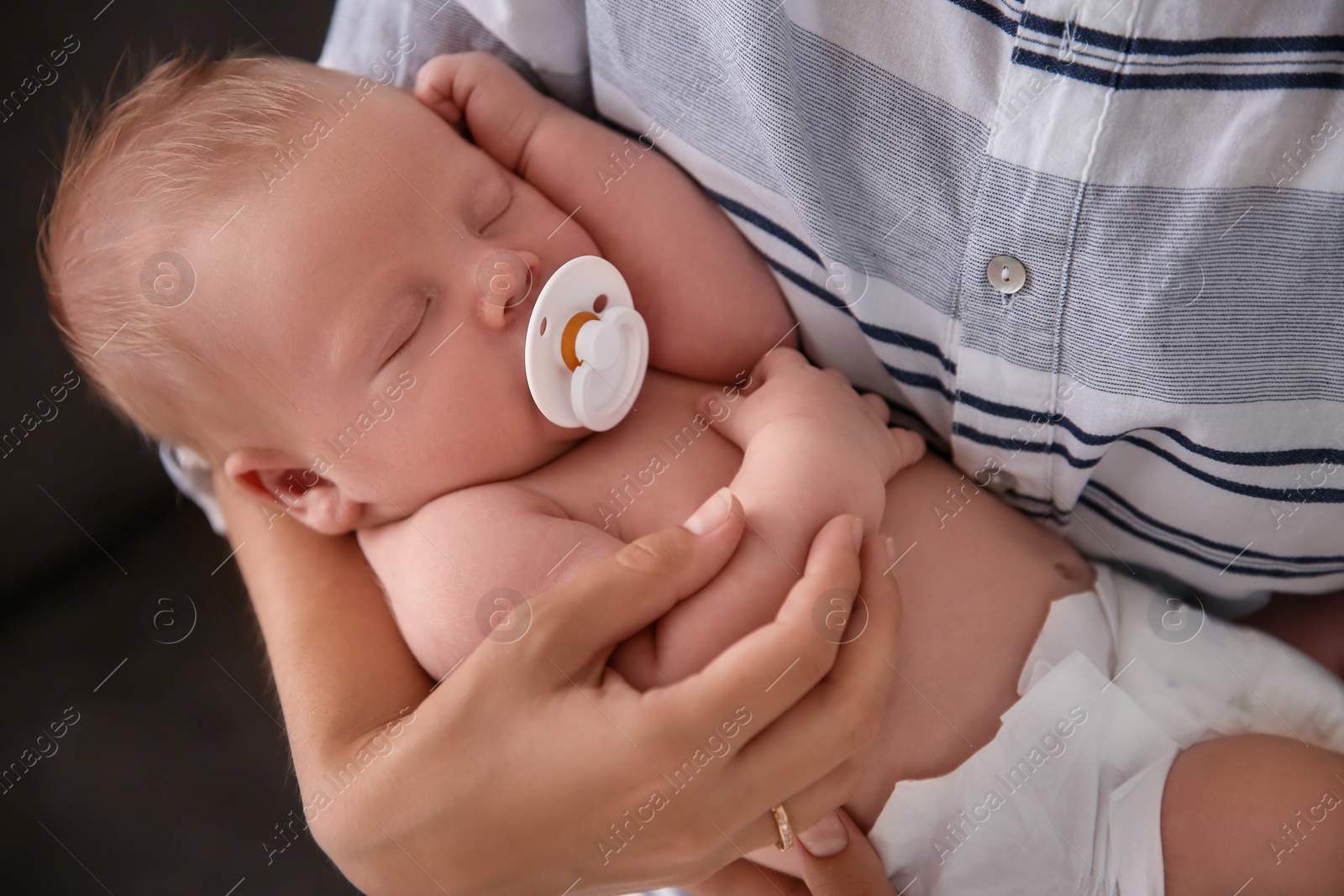 Photo of Mother with her newborn baby, closeup view