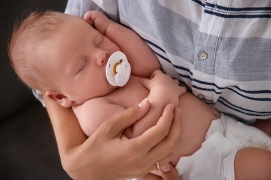 Mother with her newborn baby, closeup view