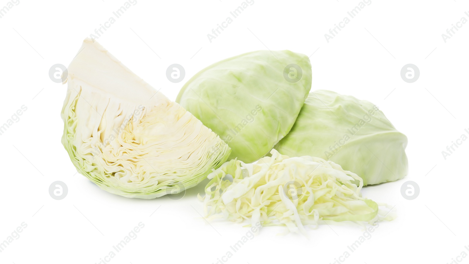 Photo of Cut fresh ripe cabbages on white background