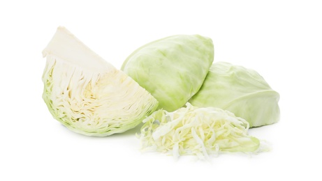 Photo of Cut fresh ripe cabbages on white background