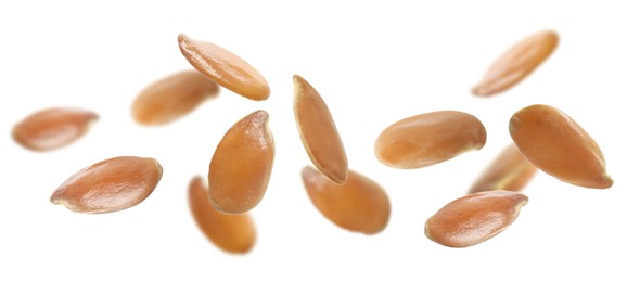 Image of Many linseeds falling on white background, banner design. Vegan diet  