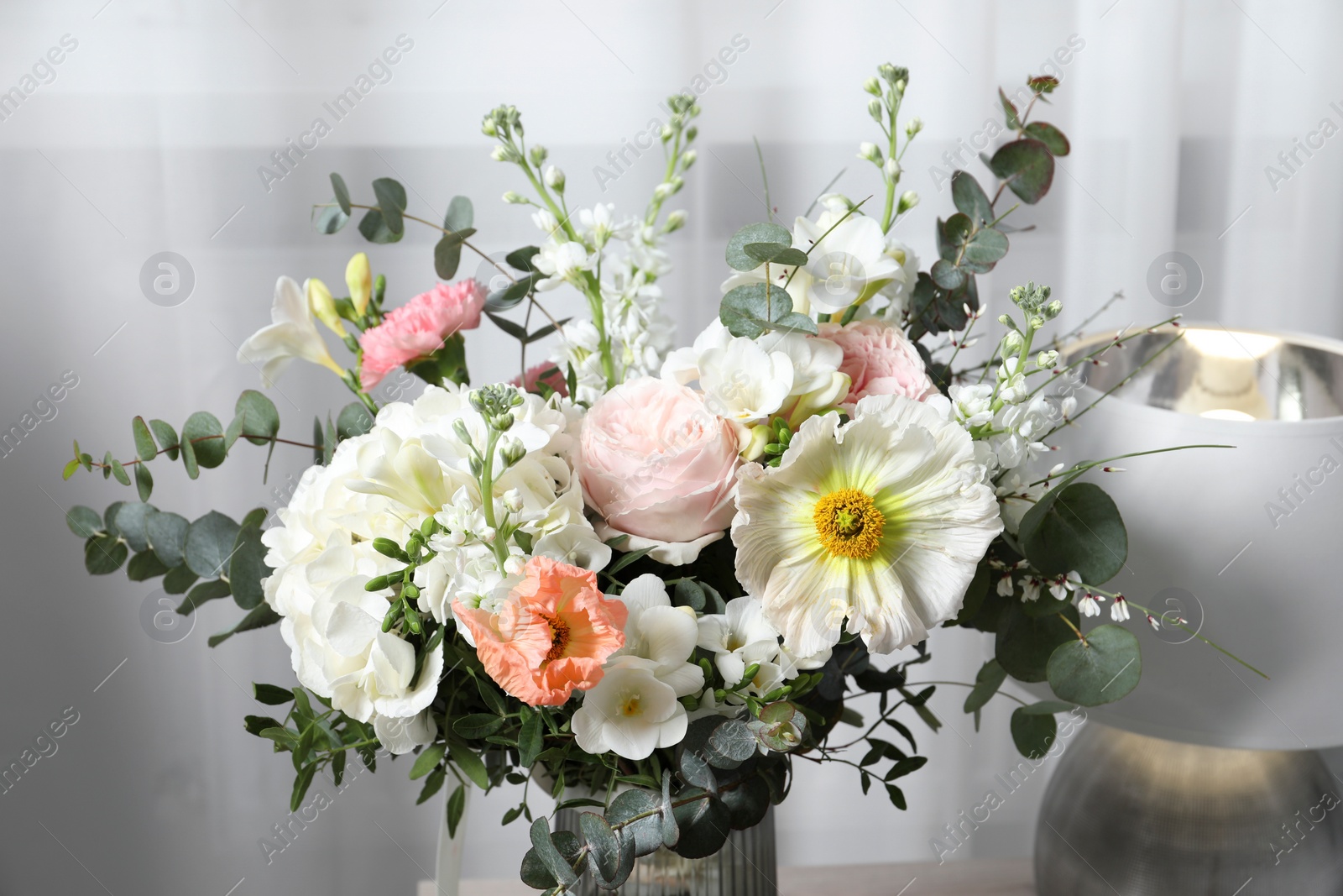 Photo of Beautiful bouquet of different fresh flowers indoors, closeup