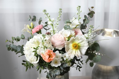 Beautiful bouquet of different fresh flowers indoors, closeup