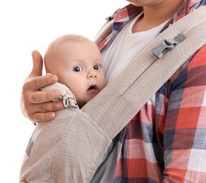 Father holding his child in baby carrier on white background, closeup