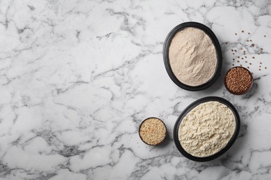 Composition with different types of flour on marble background