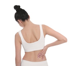 Woman suffering from pain in back on white background