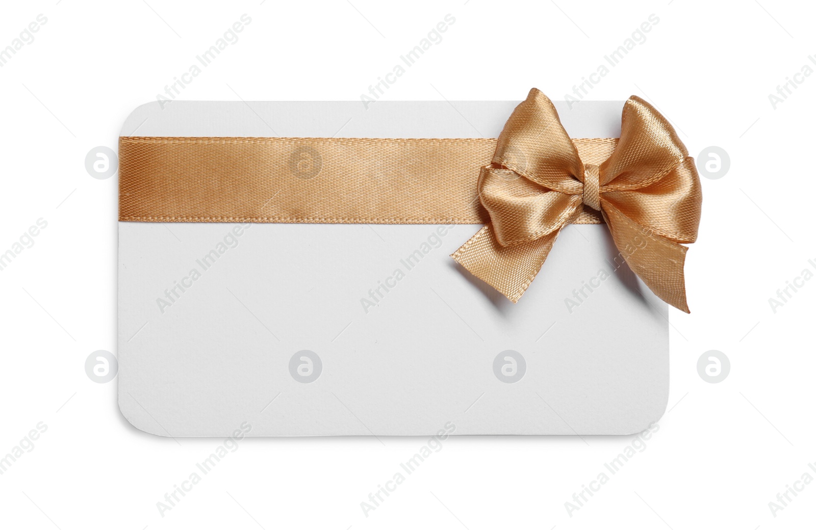 Photo of Blank gift card with golden bow isolated on white, top view