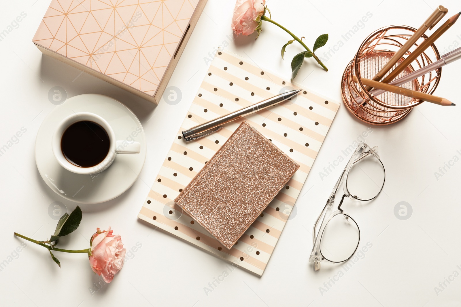 Photo of Flat lay composition with notebooks, cup of coffee and stationery on white background